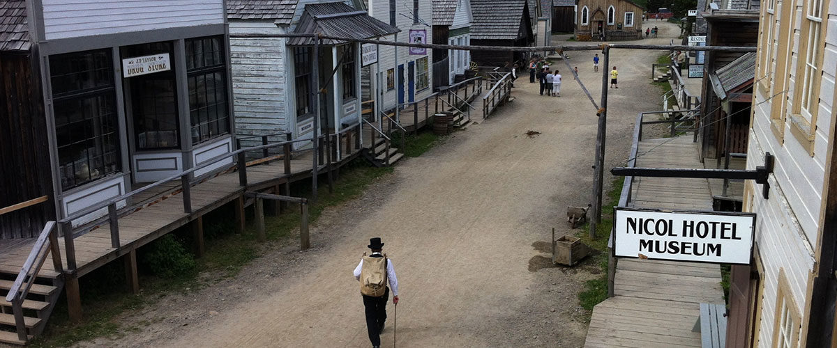 A person walks down a street in the historic town of 