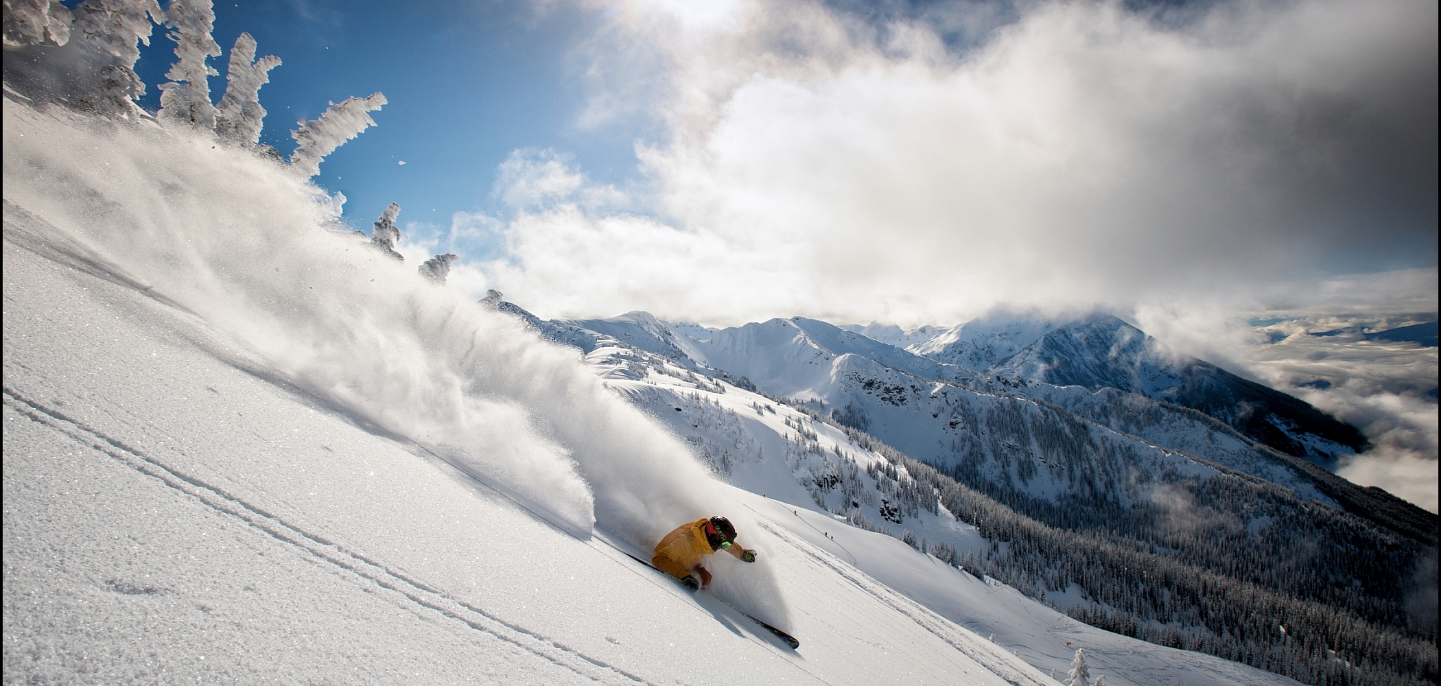 A skier revels in deep snow at Revelstoke Mountain Resort 