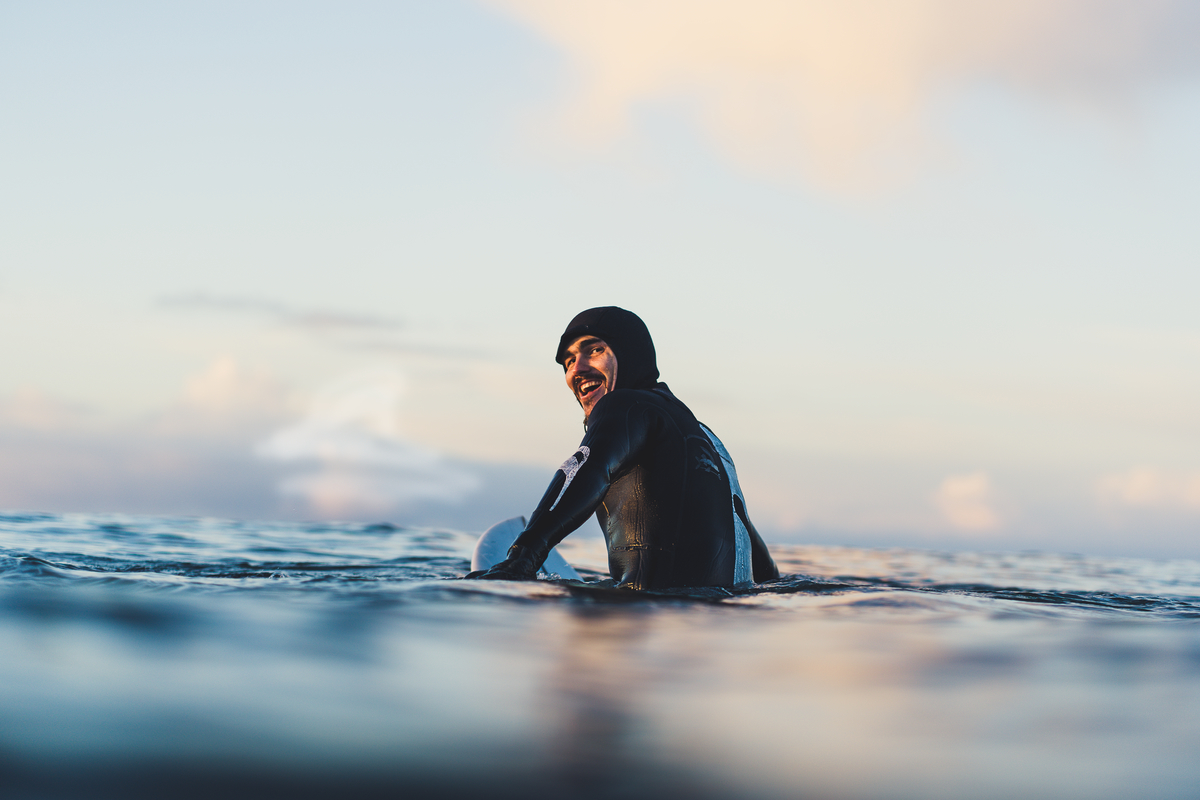 urfer and carver, Gwaliga Hart, surfing at North Beach, Naikoon Provincial Park | John Scarth