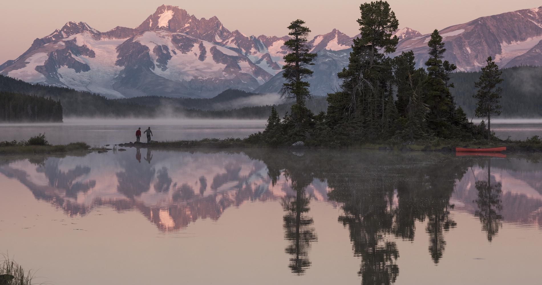 Canoeists at Nuk Tessli Wilderness Experience with view of the Coast Mountains (Monarch Range), Whitton Lake, BC  Kari Medig