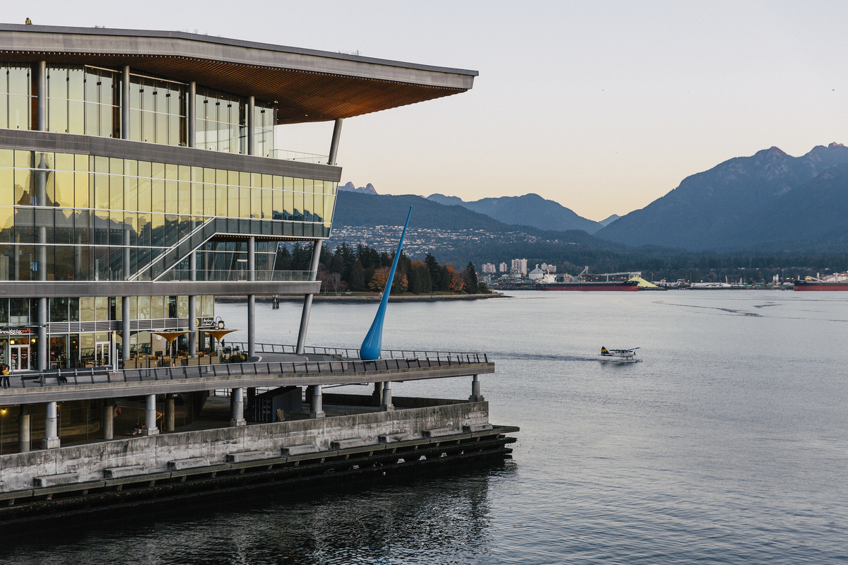 Outdoors at the Vancouver Convention Centre. Located on the water in downtown Vancouver, this building has glass windows and offers views over the ocean and north shore.
