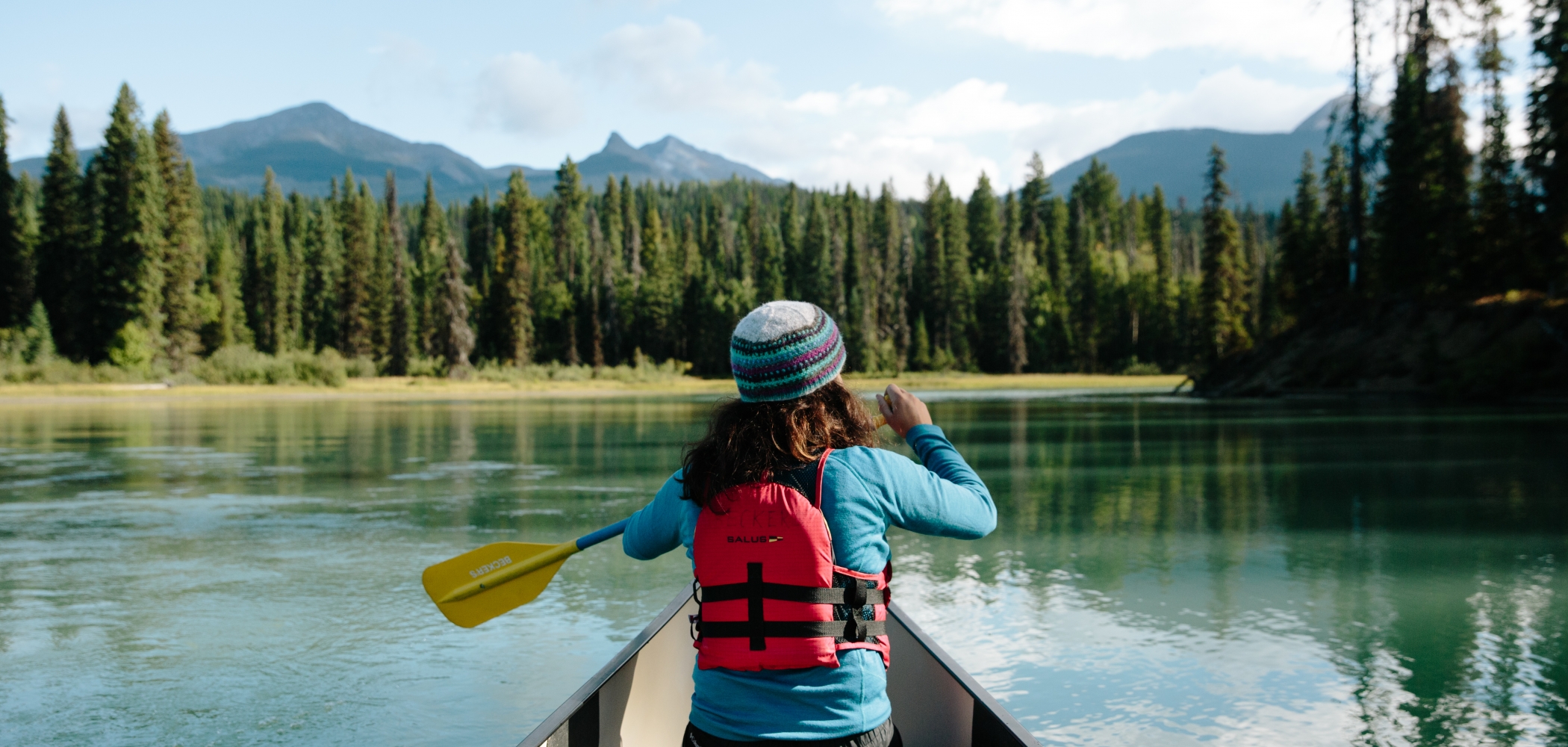 Canoer paddling along the Bowron Lake Provincial Park