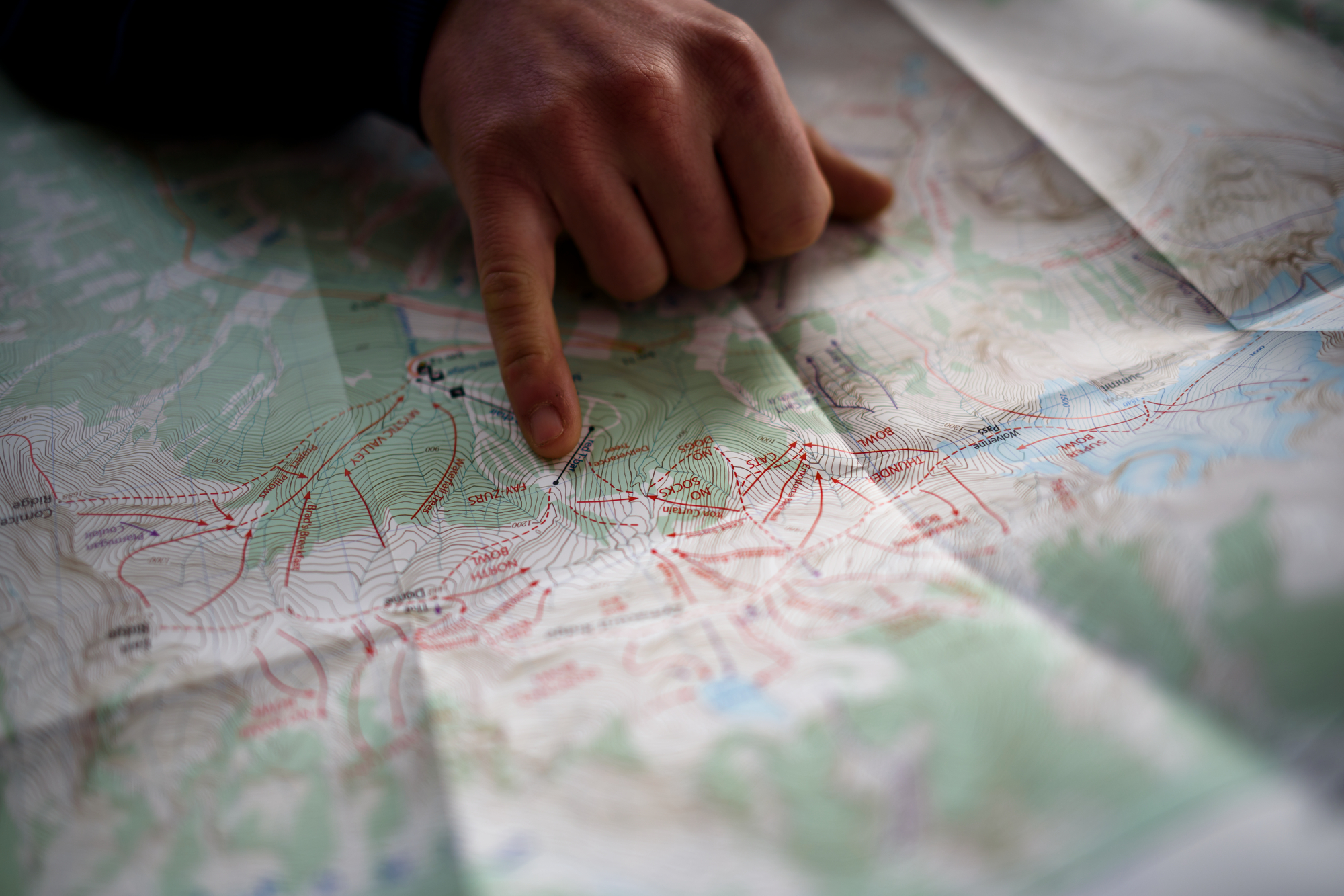 A person's hand points to a map of Terrace