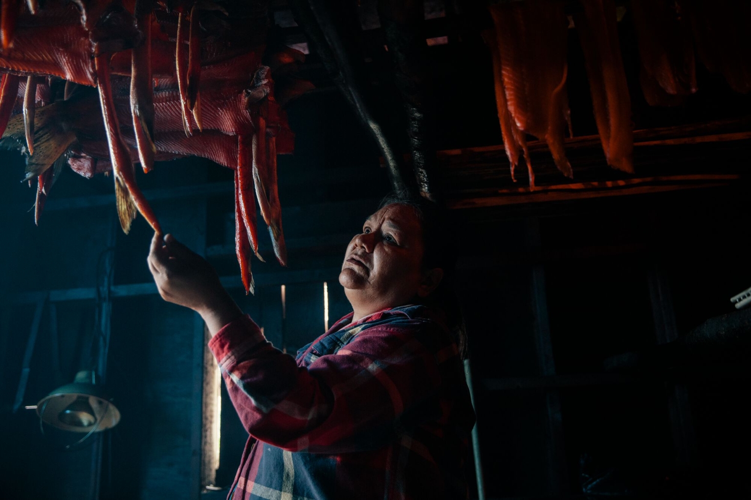 A person smokes salmon in a smoke house in village of Gingolx in the Nisga'a Nation.  