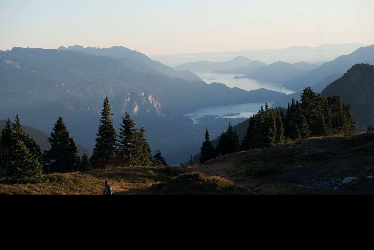 Aerial views of Howe Sound archipelagos, mountain peaks and ocean fjord.